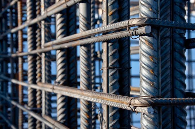 Close-up of tied reinforcement bar joints against the sky
